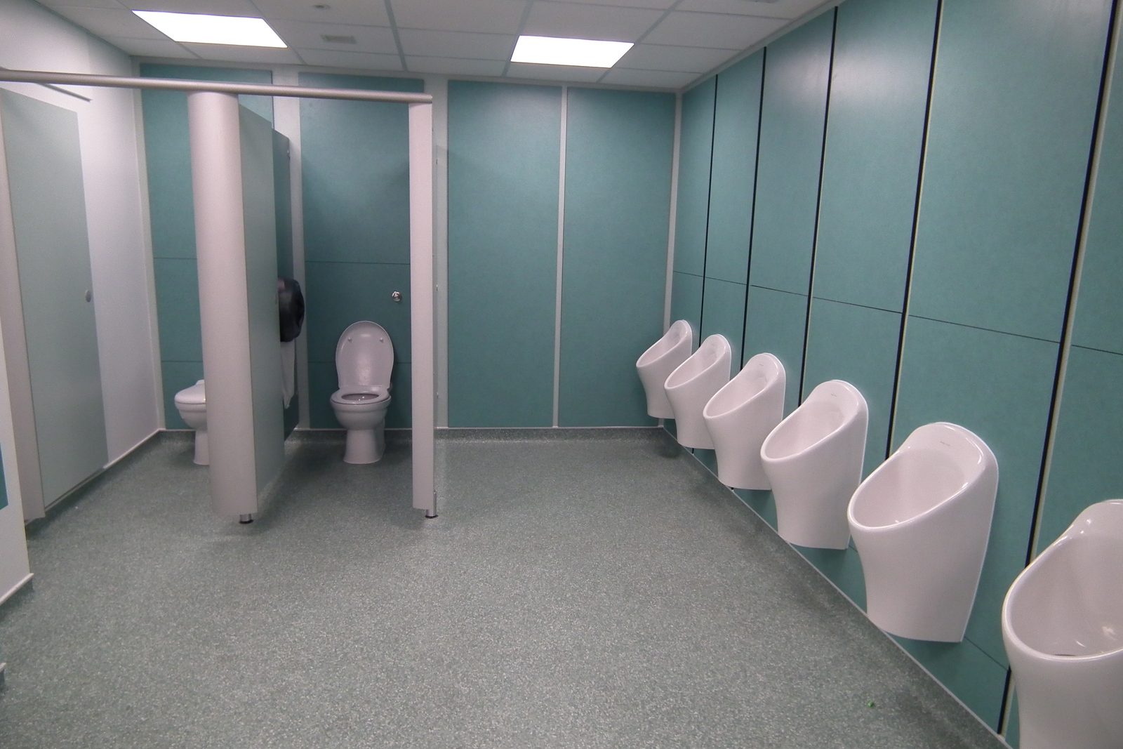 Refurbished washroom with new cubicles, wall panelling and urinals
